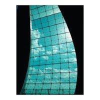a blue sky is seen through a glass window